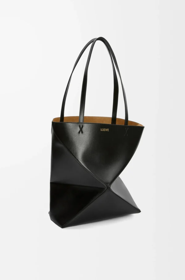 Medium Puzzle Fold tote in shiny calfskin Black