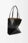 Medium Puzzle Fold tote in shiny calfskin Black