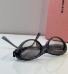 MiuMiu Retro Oval Statement Sunglasses